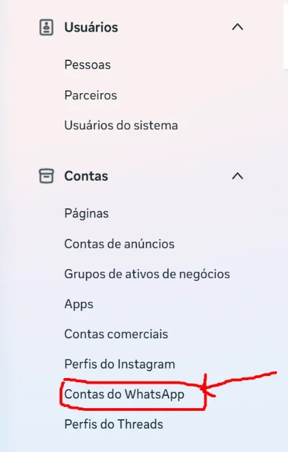 Menu lateral das configurações do portfólio empresarial do Meta, com a opção Contas do WhatsApp destacada em vermelho